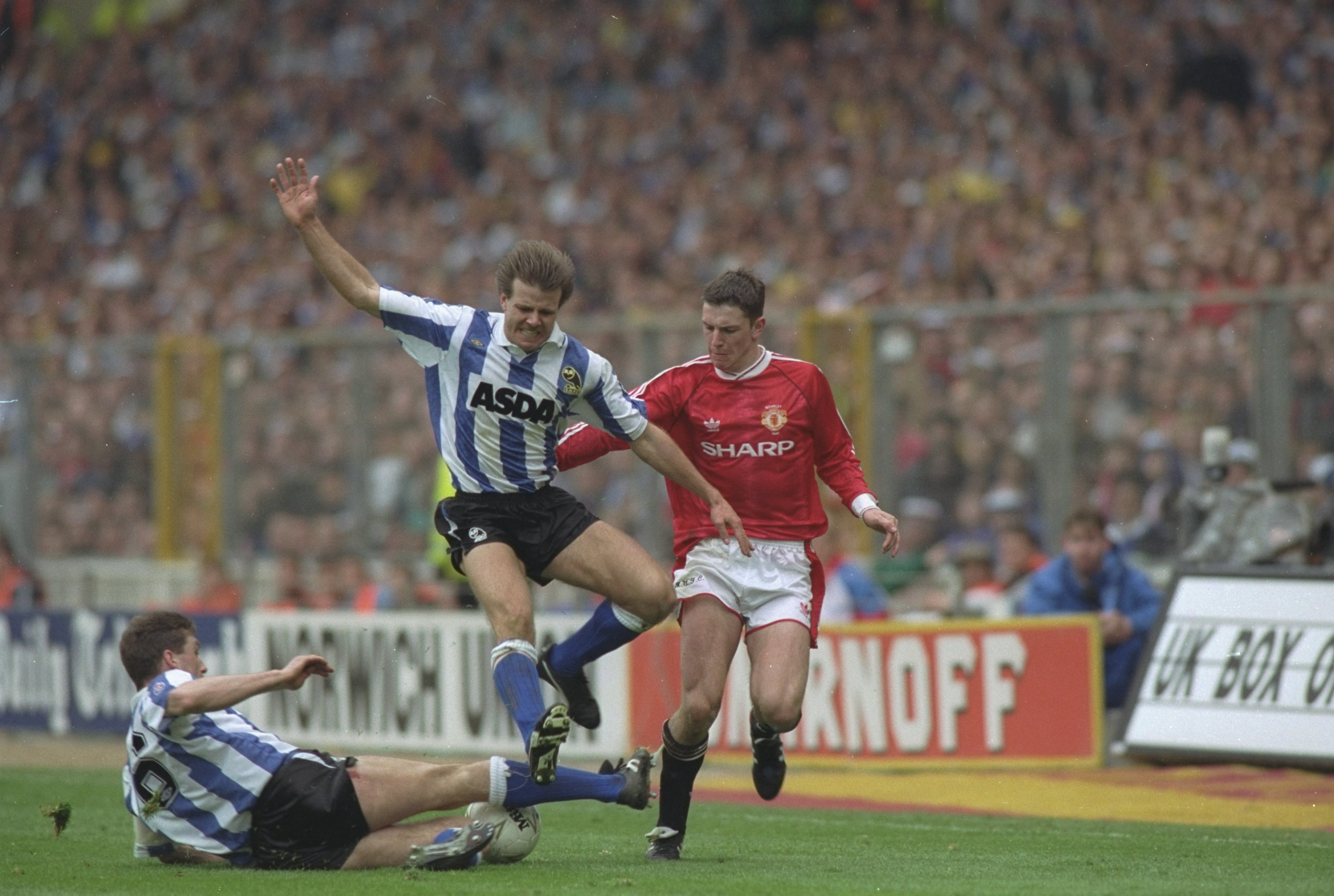 roland-nilsson-and-nigel-pearson-of-sheffield-wednesday-and-lee-sharpe-of-manchester-united.jpg